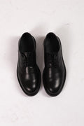 Stringata nera in pelle